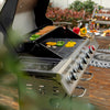 Royal Gourmet Outdoor grill with vegetables being cooked on a wooden deck