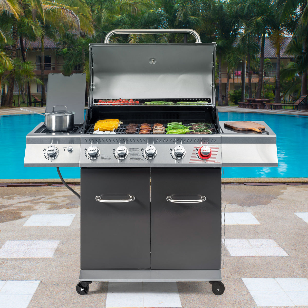 A stainless steel 4-burn Royal Gourmet gas grill with a charcoal basket, lid, side burner, and lower storage cabinet, shown outdoors by a swimming pool with palm trees in the background.