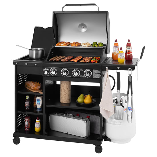 Black Royal Gourmet barbecue grill with cooking utensils and ingredients on a white background