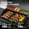 Royal Gourmet Grill with food items on a black background, featuring text about cooking area and warming rack.