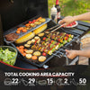 Royal Gourmet Grill with various food items being cooked, including vegetables and meats, with a person using tongs.