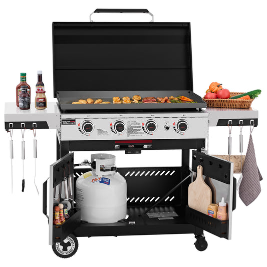 A large black and silver Royal Gourmet gas grill with the lid open, cooking food on the grates. The grill has side shelves holding condiments and vegetables, hanging utensils, a cutting board, and a propane tank in the lower compartment, all shown on a white background.