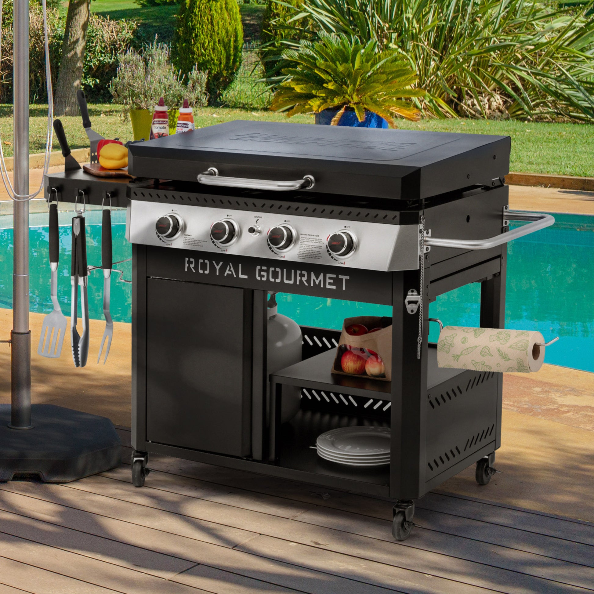 Black Royal Gourmet grill on a wooden deck with a pool in the background