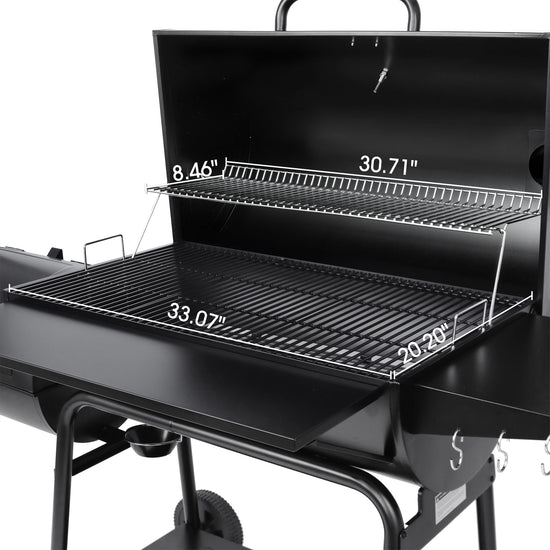 Black barbecue grill with measurements indicated on a white background