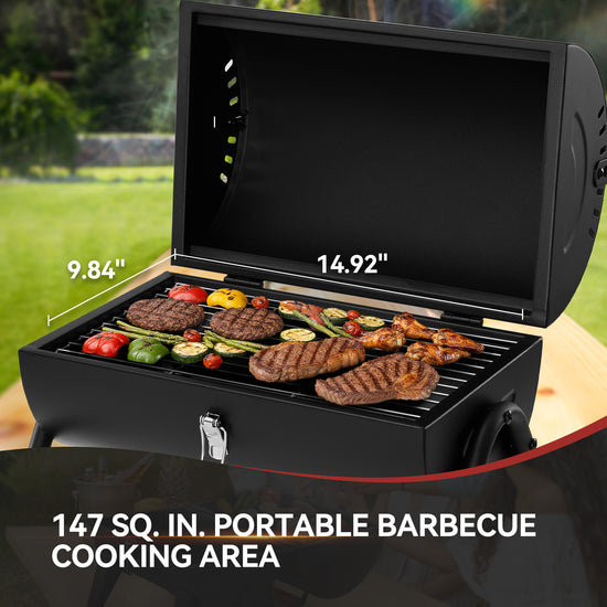 Royal Gourmet Portable barbecue grill with food on a wooden surface outdoors