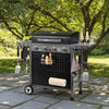 Royal Gourmet Black barbecue grill with accessories on a patio