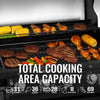  Royal Gourmet Grill with various meats and vegetables cooking on different racks, with text indicating total cooking area capacity.