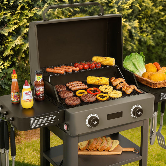 Portable Royal Gourmet grill with food and condiments on a grassy outdoor setting