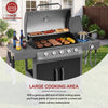 Royal Gourmet Gas grill with food on a patio, featuring a brand logo and text about cooking capacity.