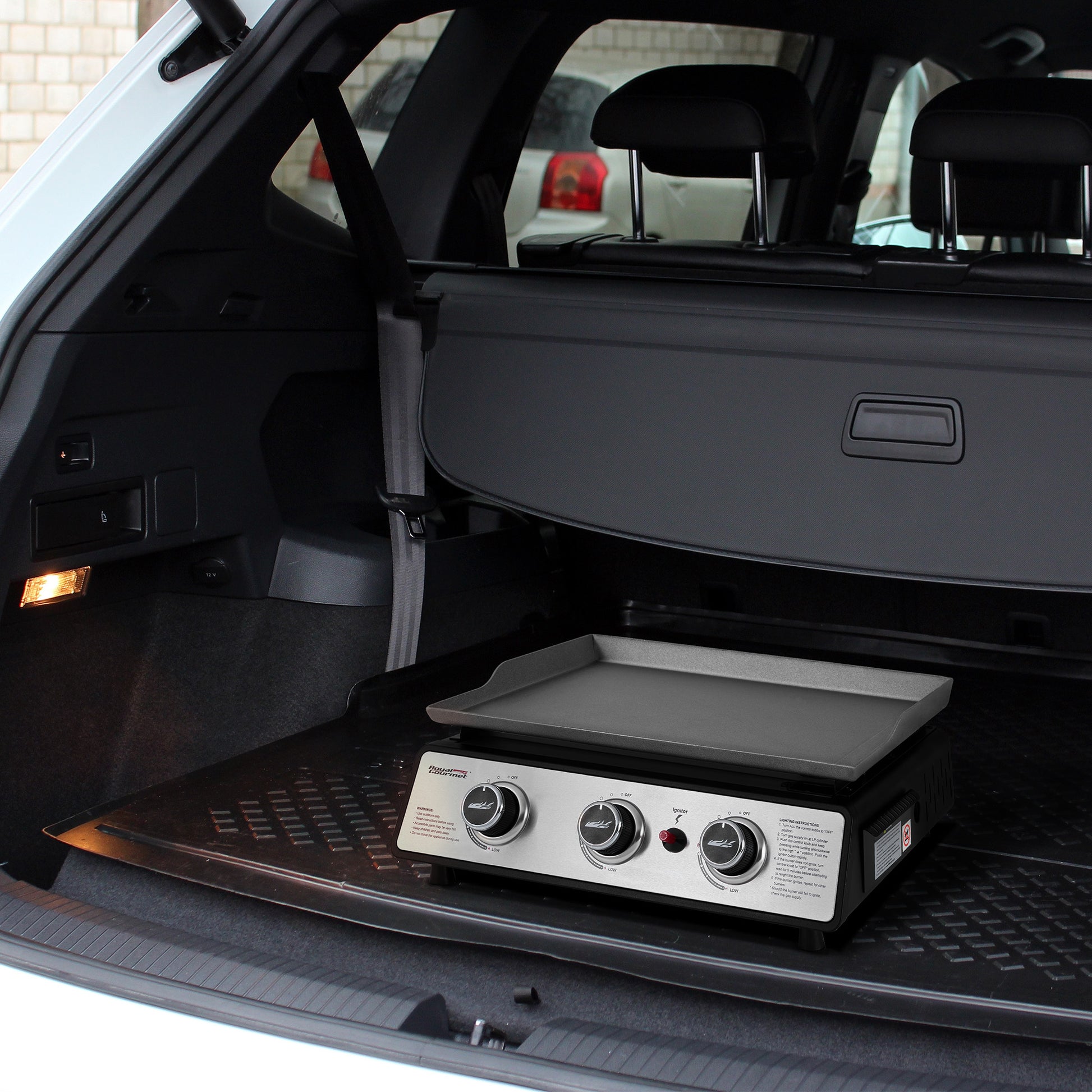 Royal Gourmet Portable grill in the trunk of a car