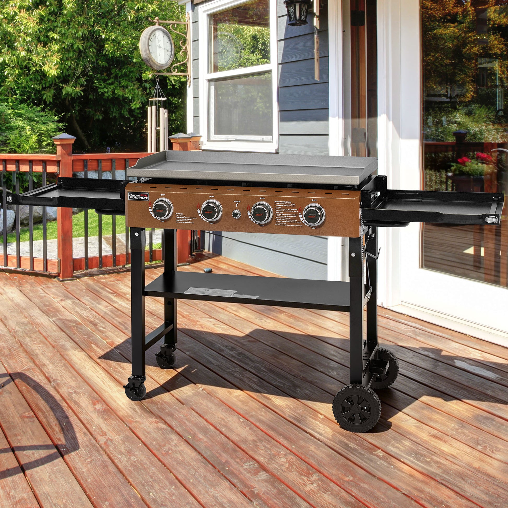 Royal Gourmet Barbecue grill on a wooden deck with a house in the background