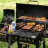 Royal Gourmet Barbecue grill with various meats, vegetables, and condiments on a grassy background