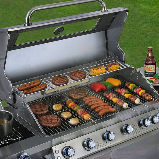 Royal Gourmet Grill with various food items being cooked on a grassy background