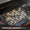 Close-up of a Royal Gourmet grill with porcelain-enamedled grates and glowing coals.