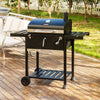 Black  Royal Gourmet barbecue grill on a wooden deck with outdoor furniture in the background 