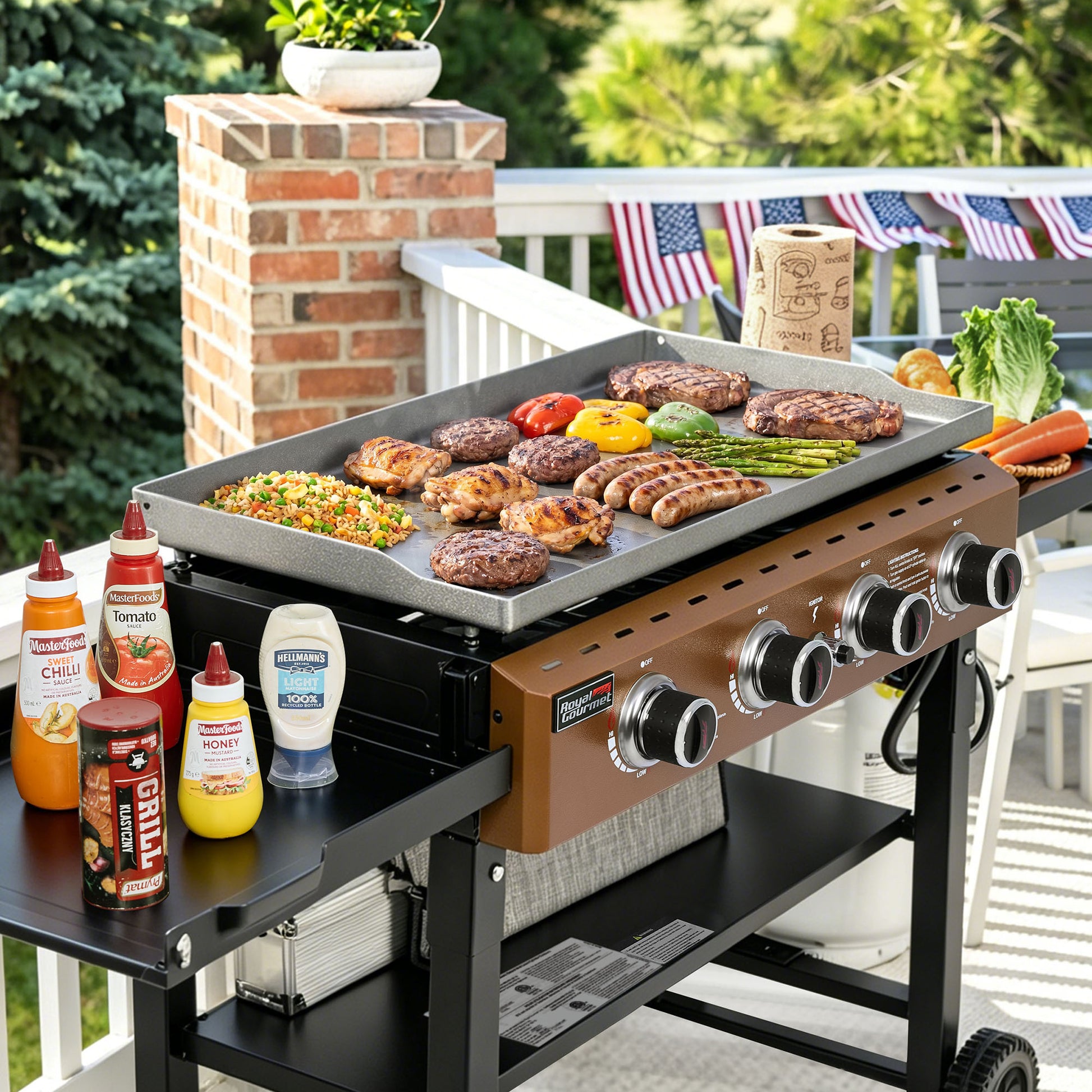 Royal Gourmet Outdoor grill with food and condiments on a patio