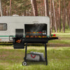 Royal Gourmet Barbecue grill with food being cooked in front of a trailer in a forest setting
