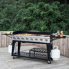 Royal Gourmet Outdoor grill on a wooden deck with trees in the background
