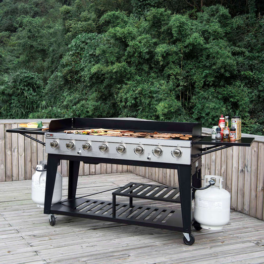Royal Gourmet Outdoor grill on a wooden deck with trees in the background