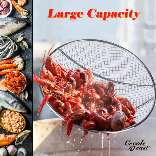Large capacity strainer filled with crawfish next to seafood ingredients on a dark surface.