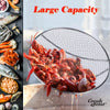 Large capacity strainer filled with crawfish next to seafood ingredients on a dark surface.