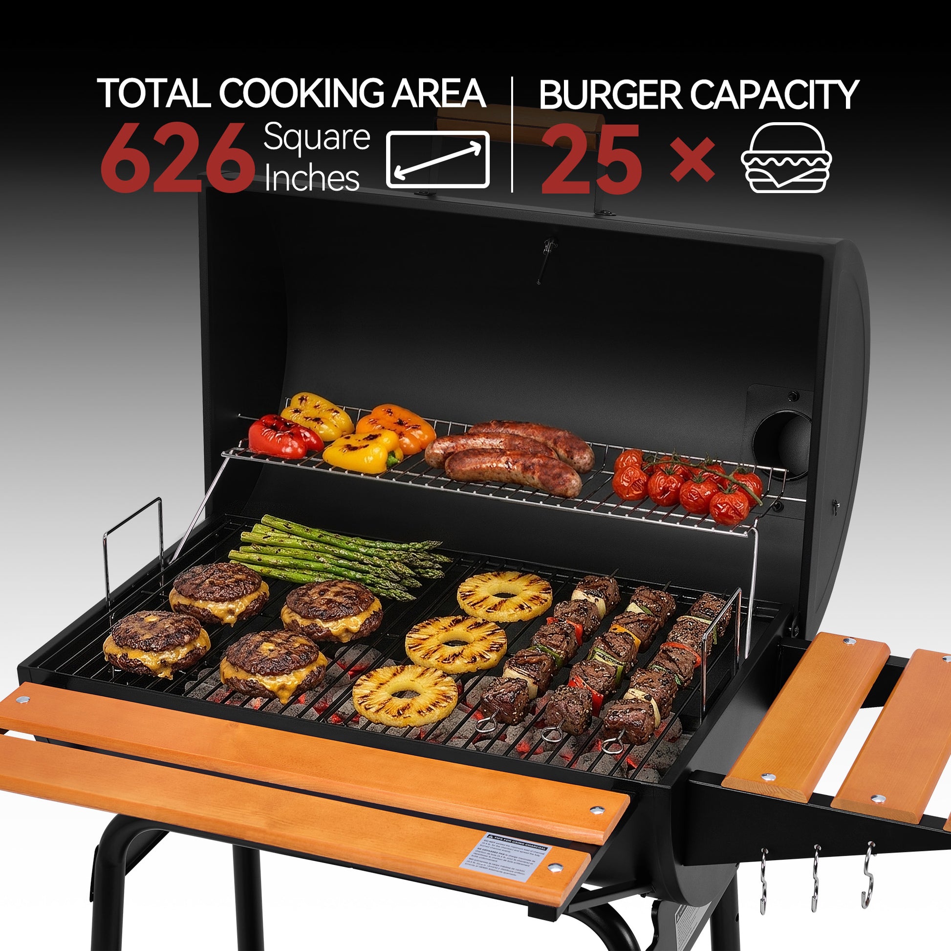 A black outdoor Royal Gourmet gas grill with an open lid and extended wooden side tables, shown cooking burgers, steak skewers, asparagus, peppers, and tomatoes. White and red text at the top highlights cooking area and burger capacity, with a black-to-gray gradient background.