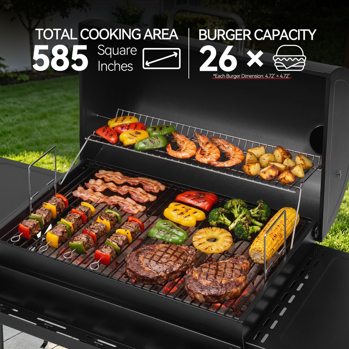 Open black Royal Gourmet outdoor grill with multiple foods cooking on the grates and a secondary rack above, set in a grassy outdoor area. Large text at the top reads 'TOTAL COOKING AREA 585 Square Inches' and 'BURGER CAPACITY 26 x'.