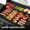 A large black Royal Gourmet gas grill loaded with food, including sausages, chicken, shrimp, asparagus, bread, and potatoes, with overlaid text showing cooking area sizes of 159 sq in on the warming rack and 499 sq in for the main cooking area.