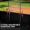 A close-up outdoor shot of a black Royal Gourmet grill insert holding a two-tier orange wooden charcoal pan, with red arrows and text reading '2-LEVEL ADJUSTABLE CHARCOAL PAN' and 'Delivers precise, better heat control for perfect grilling.'.