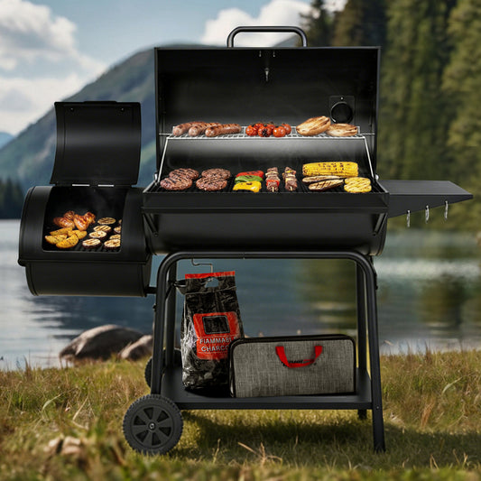 Black barbecue grill with food being cooked outdoors by a lake with mountains in the background
