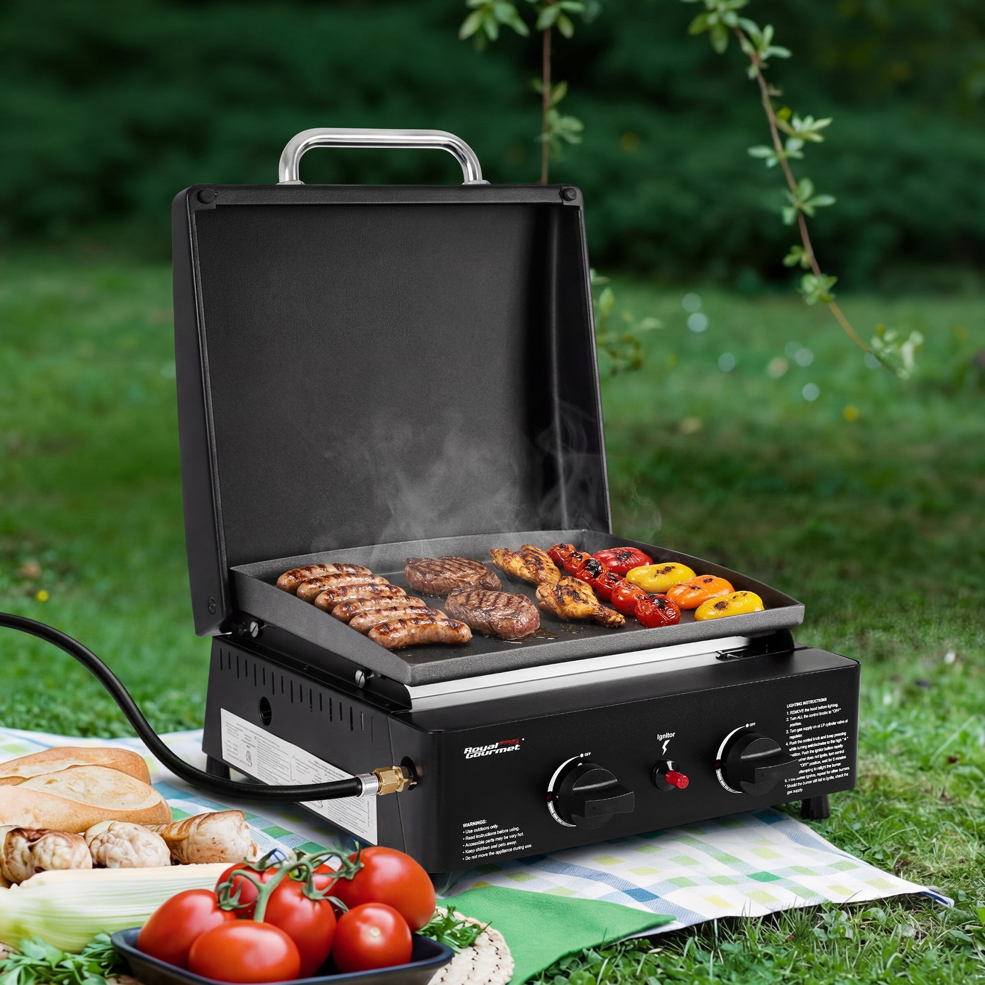 Portable Royal Gourmet grill with food on a grassy outdoor setting