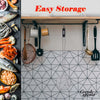 Kitchen storage solution with hanging utensils and a geometric tile backsplash.