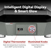 A close-up of a countertop Royal Gourmet  gas grill or burner unit with a gray body, black top surface, digital temperature display reading 305°F, and illuminated control knobs. Large text at the top reads 'Intelligent Digital Display & Smart Glow,' and callout text at the bottom highlights the digital thermometer and illuminated knobs.