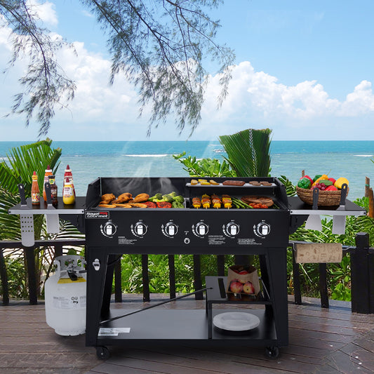 Barbecue grill with food on a deck overlooking the ocean