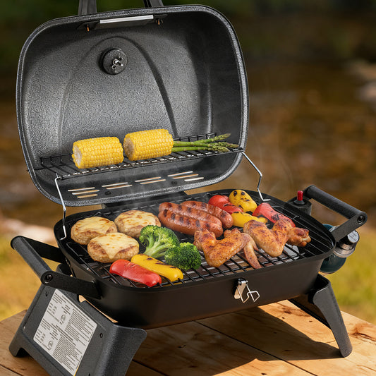Royal Gourmet Portable grill with food on a wooden surface outdoors