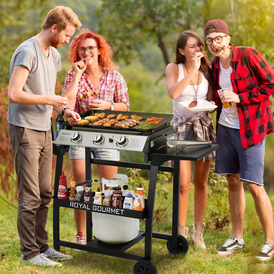 Group of people grilling outdoors with a Royal Gourmet grill.