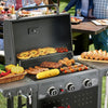 Royal Gourmet Barbecue grill with food being cooked outdoors, people in the background
