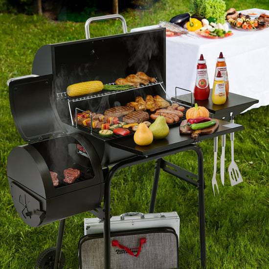 Royal Gourmet Black barbecue grill with food on a grassy outdoor setting
