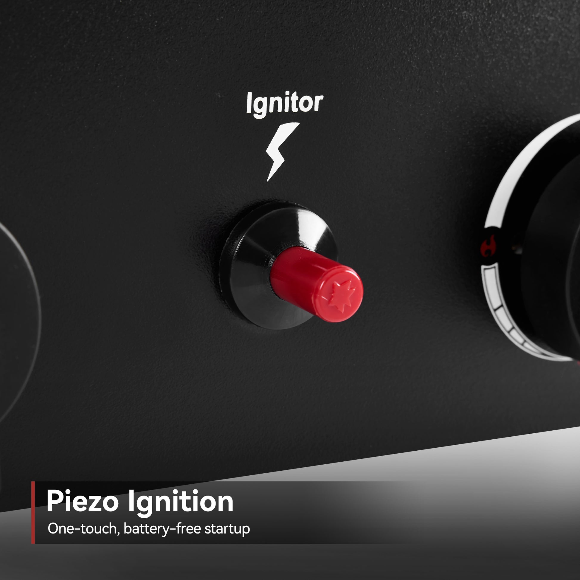 Piezo ignition button on a black surface with 'Ignitor' branding.