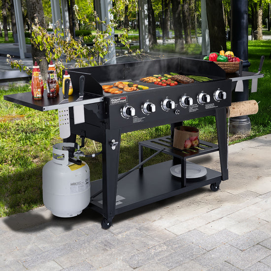 Black Royal Gourmet  barbecue grill with food and accessories on a patio