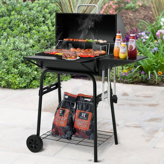 Royal Gourmet Portable barbecue grill with food and condiments on a patio