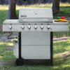 Royal Gourmet Stainless steel grill on wheels in an outdoor setting with trees and grass.