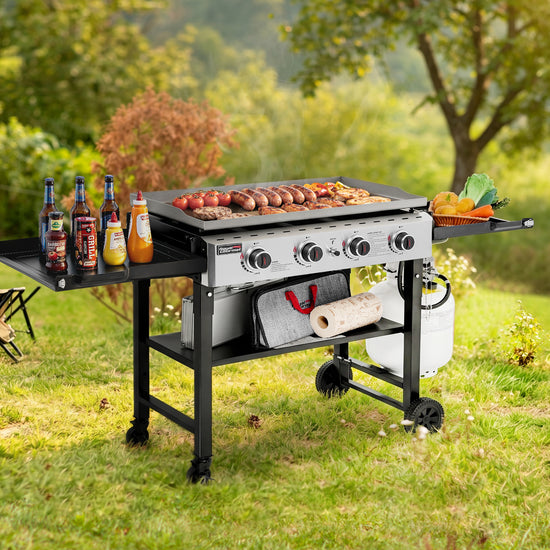 Outdoor Royal Gourmet grill with food and drinks on a grassy area