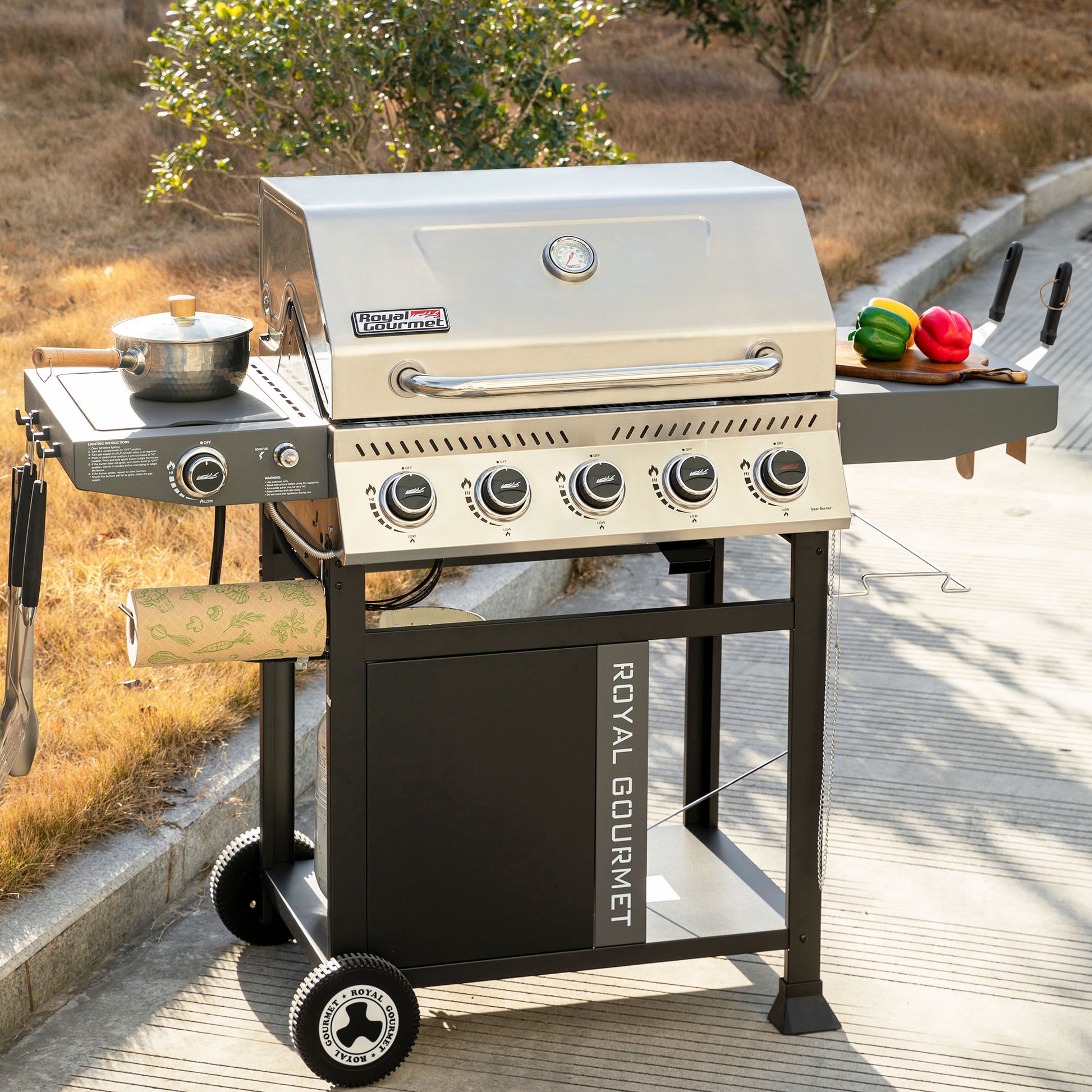 Royal Gourmet Outdoor grill with vegetables on a wooden deck