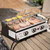 Royal Gourmet  Portable grill with food on a wooden surface outdoors