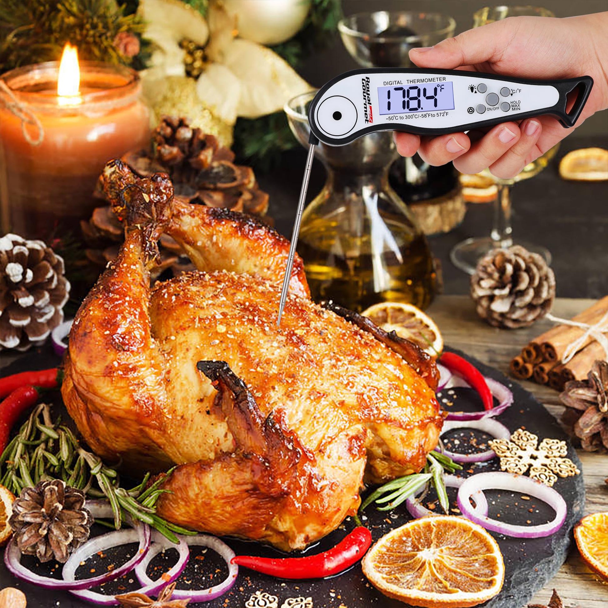 Roasted chicken with a Royal Gourmet digital thermometer on a festive table setting.
