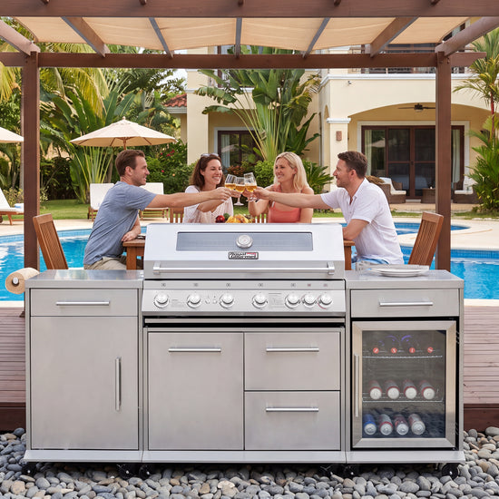 A large stainless steel Royal Gourmet outdoor kitchen island with a built-in gas grill, lower cabinets, drawers, and a glass-front wine cooler, shown in a backyard patio setting with three people toasting above it.