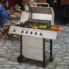 Gas grill on a patio with people dining in the background