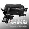 Royal Gourmet Black portable grill with foldable support legs on a gray background