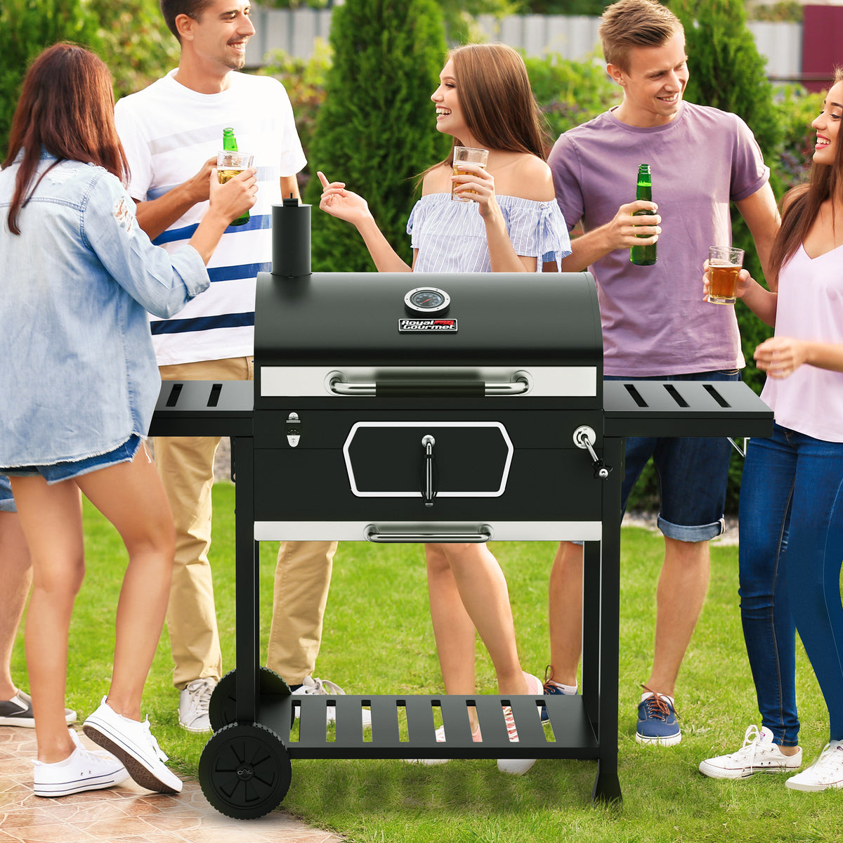 People gathered around a black Royal Gourmet barbecue grill in an outdoor setting